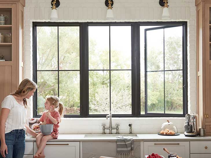 Mom and daughter enjoying the view out their new fiberglass replacement windows in Glen Allen, VA.