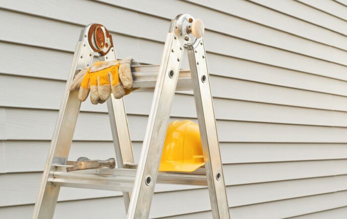 Siding contractor's step ladder and tools during a job in Richmond, VA.