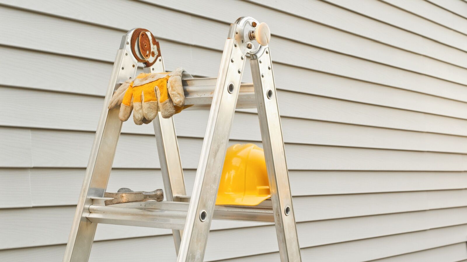 Siding contractor's step ladder and tools during a job in Richmond, VA.