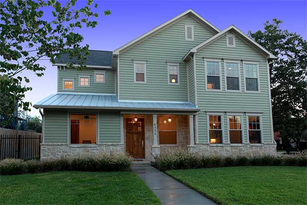 Soft green Hardie® lap siding installed by Blue Ridge Exterior in Chesterfield, VA.