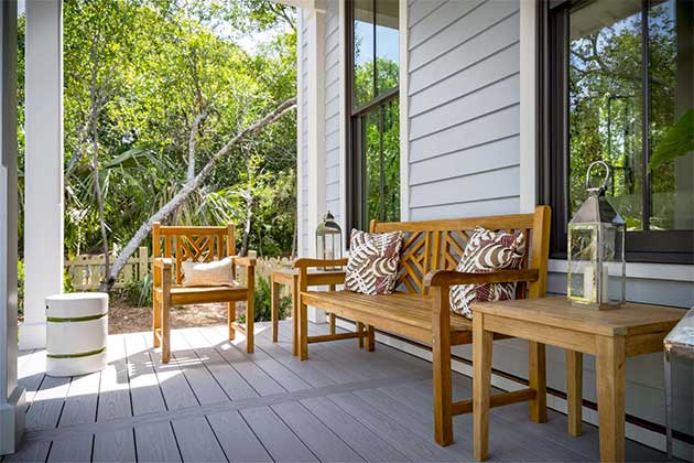 Luxury family home porch with new furniture and siding in Central Virginia.